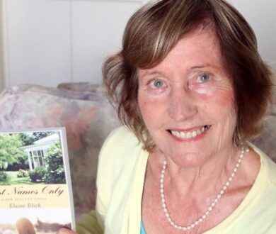 Elaine Blick holding her novel